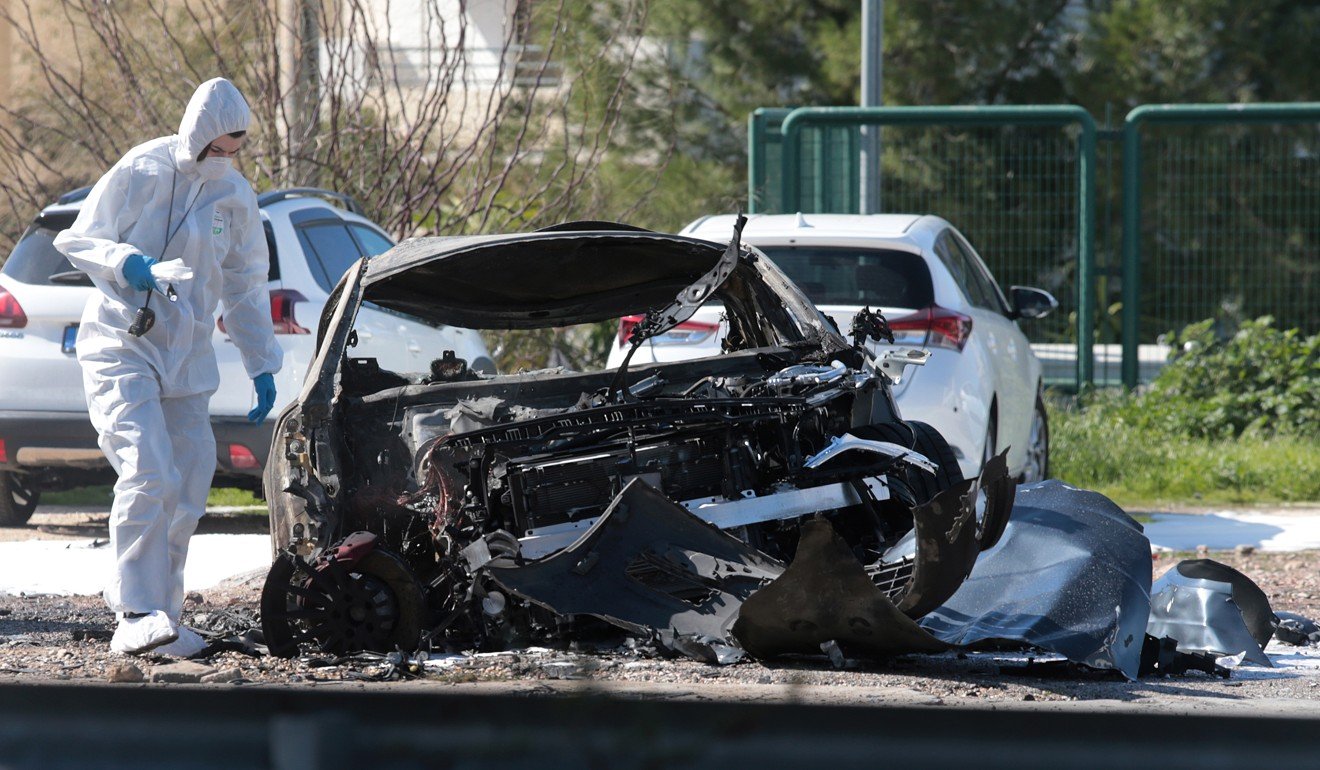 Police experts search for evidence at the site of the explosion. Photo: EPA