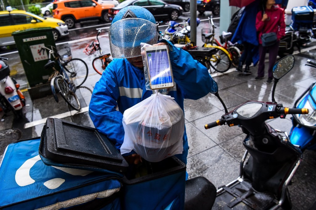 More than 322 million mobile subscribers in China are users of mobile food delivery apps. (Picture: Agence France-Presse)