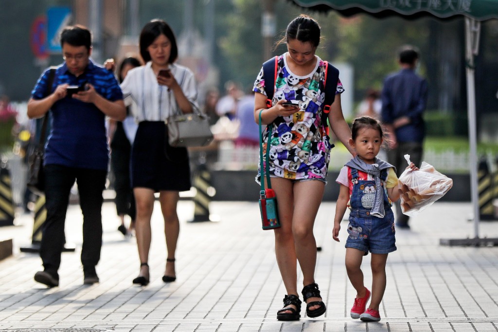 According to China’s Broadband Development Alliance, more than 85% of the population use mobile broadband. (Picture: AP Photo)