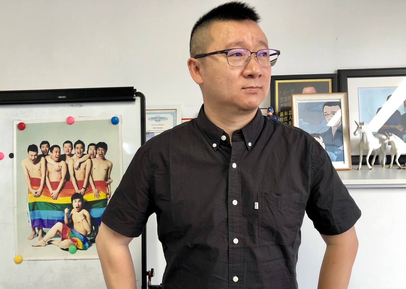 Ma Baoli stands in his office at the Blued Headquarters in Beijing.