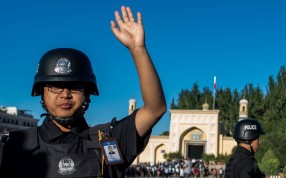 Police on patrol near a mosque in Kashgar in China’s restive Xinjiang province. The nation’s security chief hopes the use of technology will help predict where terror attacks may take place. Photo: AFP