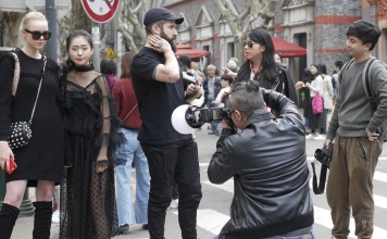 A photographer snaps Shanghai Fashion Week guests. Photo: Clay Hales