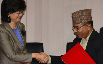 Nepal's Foreign Secretary Shankar Das Bairagi and China's Ambassador to Nepal, Yu Hong (L), exchange documents during a signing ceremony relating to the One Belt One Road initiative in Kathmandu. Photo: AFP