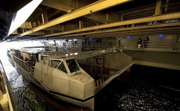 A French landing catamaran (L-CAT) assigned to the French amphibious assault ship FS Mistral (L9013) prepares to pull into the well deck of the amphibious assault ship USS Wasp in 2012. French-led amphibious force, including contingents from Japan, Britain and the United States, postponed their first-ever joint beach attack drills in the Western Pacific on Friday after a landing craft ran aground. File photo: US Navy