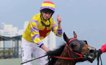 Ryan Moore gives the thumbs up after winning the BMW Hong Kong Derby. Photo: Kenneth Chan