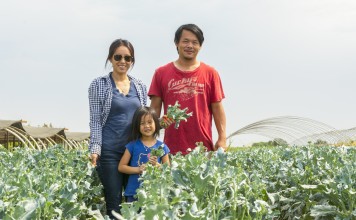 Kong Thao, 33, his wife Pang and daughter Hailey at the Thao Family Farm. Photo: Aliza Sokolow