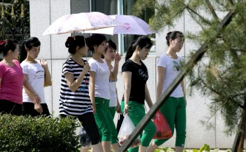 North Korean workers walk into the Hong Chao Zhi Yi garment factory in Hunchun in this 2017 photo. Photo: AP
