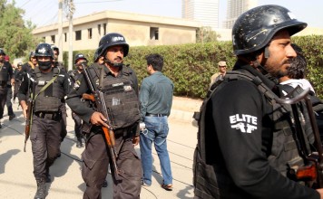 Pakistani security personnel take position near the compound of the Chinese consulate in Karachi after it was stormed in an attack reportedly claimed by the Baloch Liberation Army. Photo: EPA
