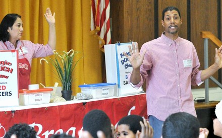 Esther Arce-Reed and Raymon Reed give a bread making demonstration at Paint Branch Elementary School. Photo: Larry Jackson.
