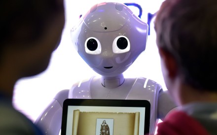Children interact with Pepper, the programmable humanoid robot. Photo: AFP