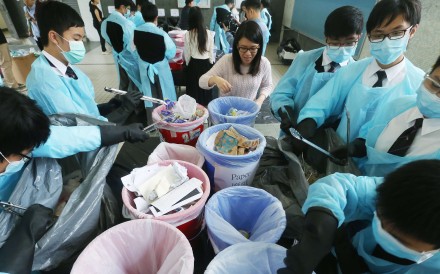 Pupils at La Salle College work on the waste reduction project. They cut schemethe number of rubbish bags used by between 37 and 46 per cent. Photo: K. Y. Cheng
