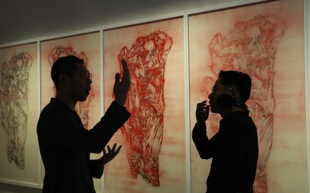 Artist Ni Youyu talks to Hung Fai, whose work The Six Principles of Chinese Painting – Transmission IV hangs behind them, at the M+ Pavilion of the West Kowloon Cultural District. Photo: Nora Tam