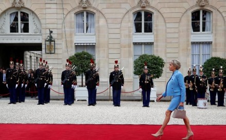 Brigitte Trogneux arrives to attend the handover ceremony between her husband, French President-elect Emmanuel Macron, and outgoing President Francois Hollande at the Elysee Palace in Paris, France, May 14, 2017. Photo: REUTERS/Christian Hartmann