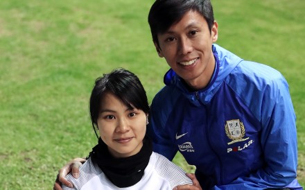 Chan Ka-ho (right) and his wife Christy Yiu Kit-ching pose for a photo during an interview at the Sham Shui Po Sports Ground. Photo: K.Y. Cheng