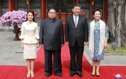 North Korea’s first lady Ri Sol-ju (left) wore a two-piece ivory-coloured dress for a lunch with Xi Jinping and China’s first lady Peng Liyuan. Photo: Reuters