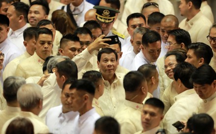 Philippine President Rodrigo Duterte, cetnre, is seen after delivering his third State of the Nation Address. Photo: Xinhua
