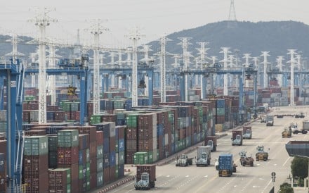 Containers stacked next to gantry cranes at the Port of Ningbo-Zhoushan in Ningbo in eastern China on Wednesday, October 31, 2018. Photo: Bloomberg