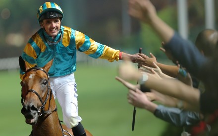 Martin Harley high fives the crowd after winning on Wednesday night. Photos: Kenneth Chan