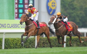 Tommy Berry celebrates his victory on Designs on Rome in the Classic Cup, with stablemate Able Friend (Joao Moreira) a vanquished favourite. Photo: Kenneth Chan