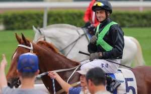 Douglas Whyte winks to a crowd member after winning at Sha Tin on Sunday with Key Witness. Photo: Kenneth Chan