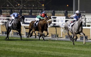 Solow (Maxime Guyon) races away for an easy win in the Dubai Turf at Meydan on Saturday night. Photos: Reuters, AFP, Kenneth Chan