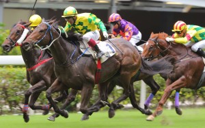 Olivier Doleuze drives giant galloper Sky King home to win the first race at the public holiday meeting at Happy Valley. Photo: Kenneth Chan