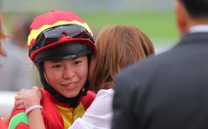 Kei Chiong receives a hug after her bizarre day culminates in a win on Multimax. Photo: Kenneth Chan