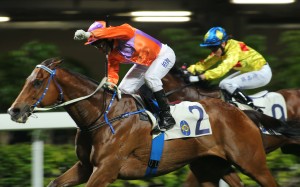Brett Prebble salutes the crowd after prevailing on Royal Partner for trainer Caspar Fownes. Photos: Kenneth Chan
