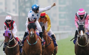 Brett Prebbles salutes after Contentment takes out the Group One Queen’s Silver Jubilee Stakes. Photo: Kenneth Chan