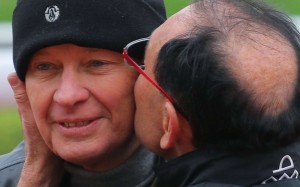 Gary Moore plants a kiss on his brother John’s cheek. Photos: Kenneth Chan