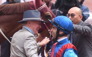 John Moore and Joao Moreira hug after winning the Hong Kong Derby with Rapper Dragon. Photos: Kenneth Chan