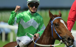 Zac Purton celebrates his 100th winner of the season after saluting on Premium Champion. Photos: Kenneth Chan