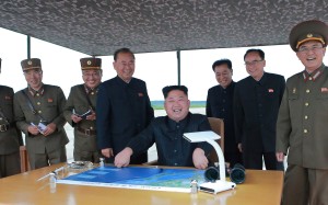 North Korean leader Kim Jong-un and his generals laugh after watching the launch of a ballistic missile on Tuesday that flew over Japan. The launch reportedly took place from Pyongyang’s airport. Photo: Reuters