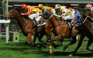 Winaswewish (cream and purple silks) finishes second to Wonderful Chaser on Wednesday night. Photo: Kenneth Chan