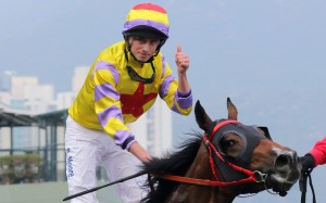 Ryan Moore gives the thumbs up after winning the BMW Hong Kong Derby. Photo: Kenneth Chan
