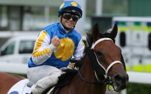 Umberto Rispoli pumps his fist after winning with Fiama. Photo: Kenneth Chan