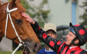 Zac Purton gives Time Warp a pat after their victory in the Citi Hong Kong Gold Cup at Sha Tin on February 18. Photos: Kenneth Chan