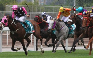 Zac Purton lifts Beauty Generation to victory in the Champions Mile. Photos: Kenneth Chan
