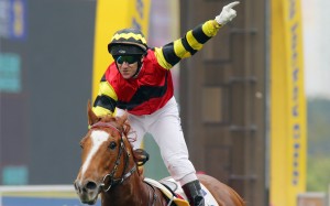 Brett Prebble salutes after a Lucky Bubbles win. Photos: Kenneth Chan