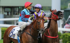 Jockeys Douglas Whyte and Joao Moreira share a moment after the Brazilian’s last race in Hong Kong. Photos: Kenneth Chan
