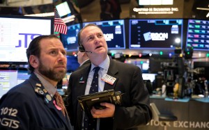 Traders work on the floor of the New York Stock Exchange on December 7. Photo: Bloomberg