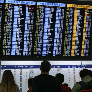 A flight information board at Hong Kong International Airport on Lantau Island. Photo: Dickson Lee