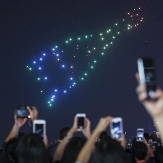 Drones burst into colour and form shapes in a media display at the Wine and Dine Festival. Photo: Felix Wong