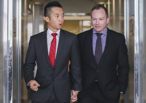 Civil servant Angus Leung (l) with his partner Scott Adams (r). Hong Kong courts recently overturned a ruling allowing him to claim spousal benefits, claiming that homosexual relationships posed a threat to traditional marriage.