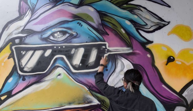 Graffiti booms in streets of Ho Chi Minh City as artists push back against censorship