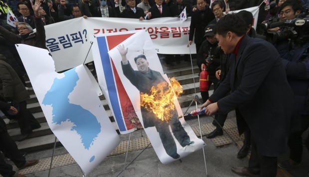 Pictures of Kim Jong-un burn as star North Korean singer tours Seoul