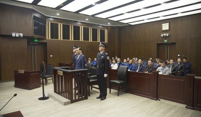 Wu Xiaohui contests all charges during his trial on Wednesday.