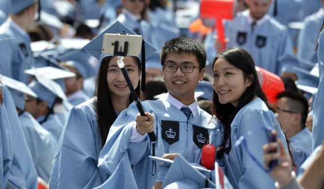 Chinese students celebrate at a Columbia University commencement ceremony.