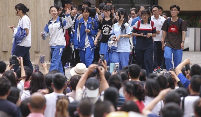 Students walk out of an exam site in Beijing after finishing the 2017 gaokao. It is the end of a 12-year ordeal.