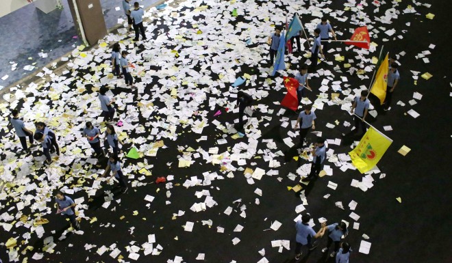 Students scatter textbook pages onto the ground in a stress-release exercise before the gaokao.